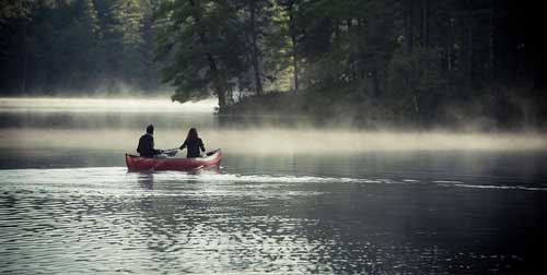 Couple Paddling Purity Spring Resort Madison New Hampshire