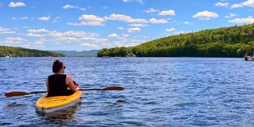 Paddling on Lake Winnepesaukee near Meredith - Lakes Region NH Tourism Association